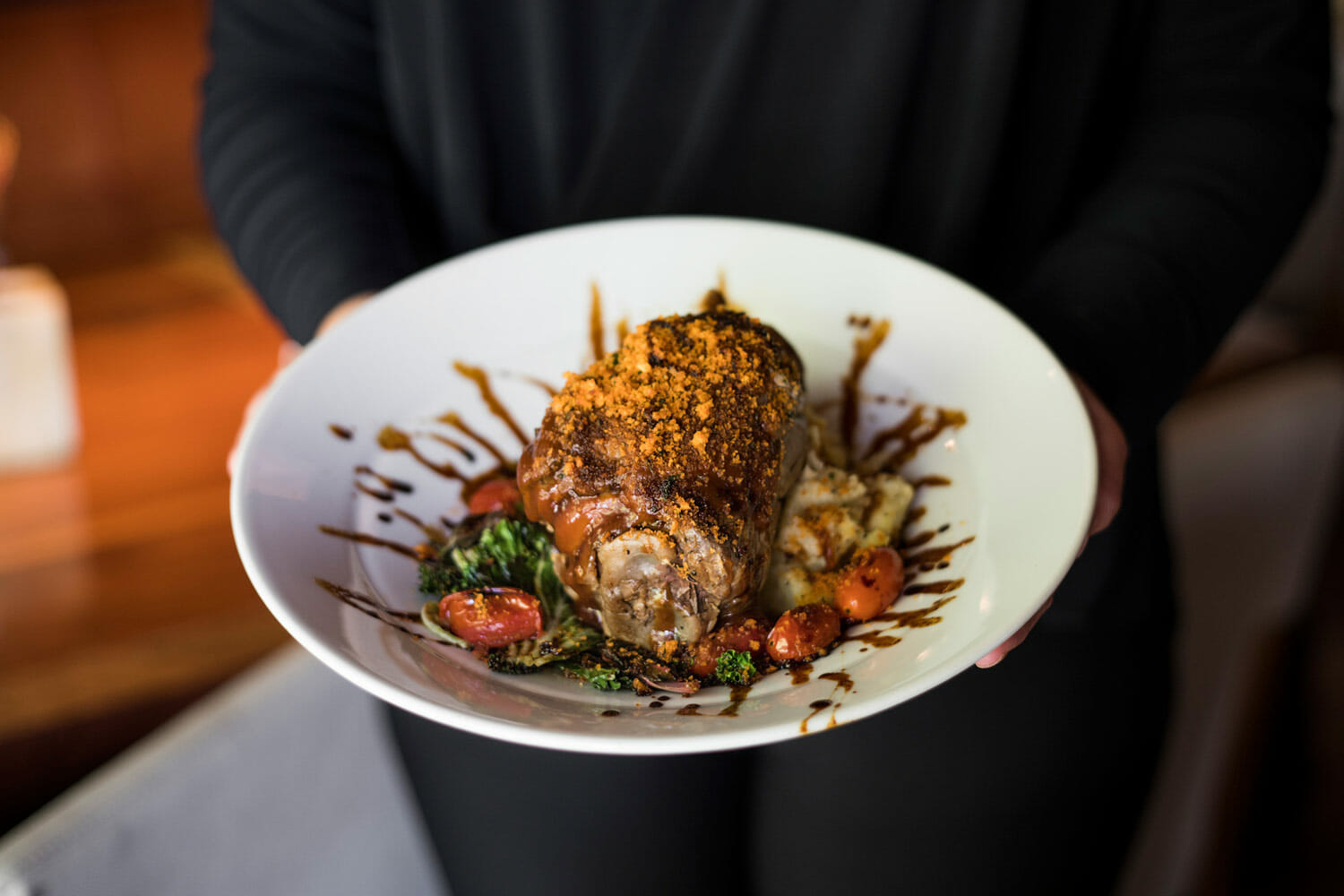 chef holding decorative dinner plate
