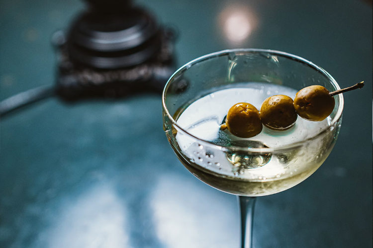 Vodka cocktail with three olives