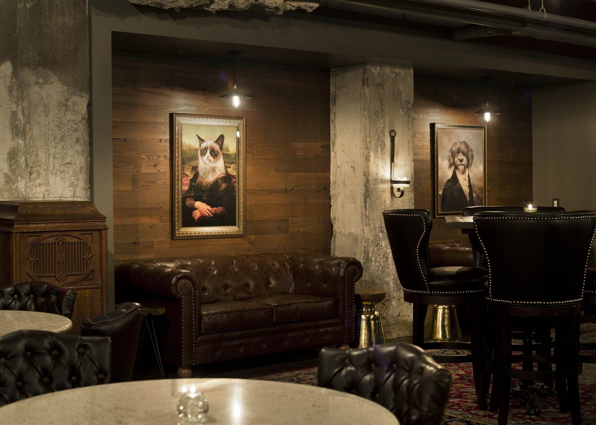 Cat and dog pictures on wall of Dockum speakeasy in Wichita, Kansas