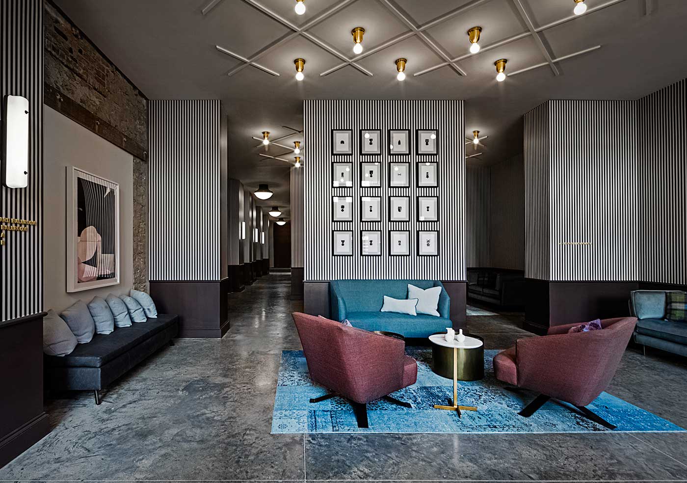large hotel lobby with artwork wall