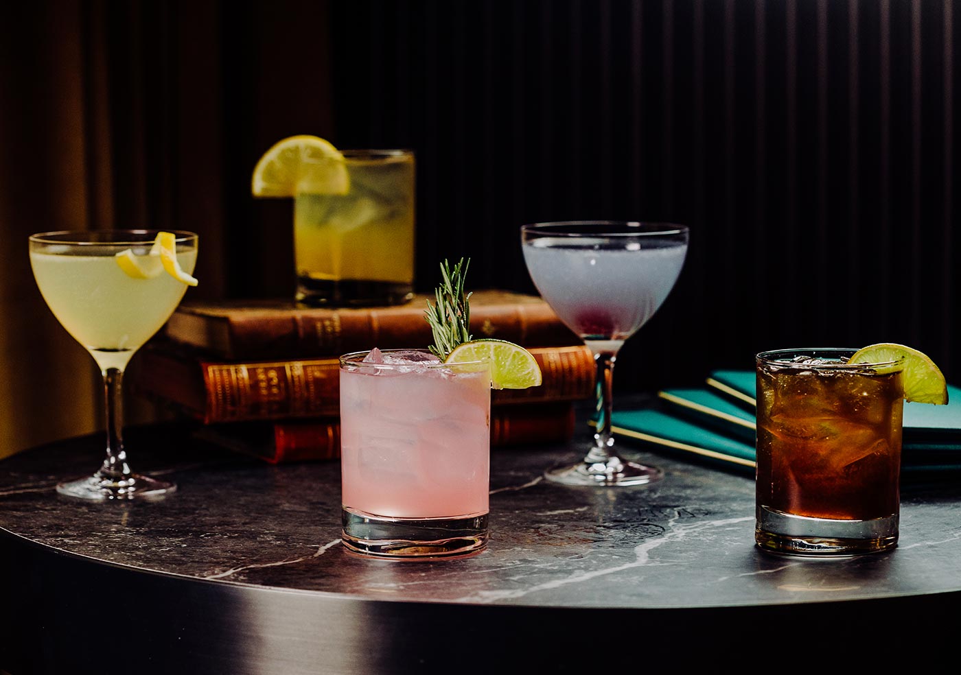 five different multicoloured cocktail glasses