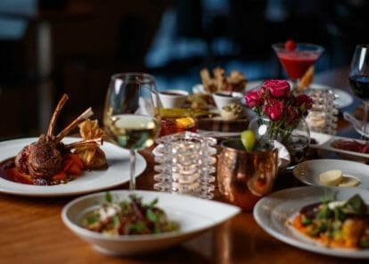 a dining table at Vast filled with beautifully prepared plates ready to eat