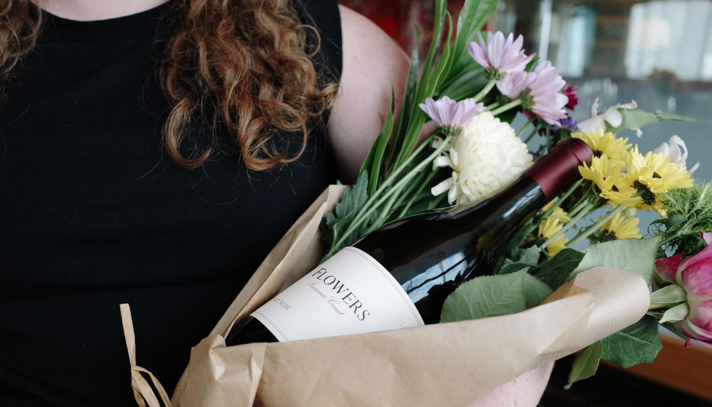 Women with flowers and wine bottle